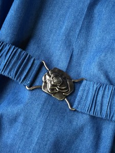 Belt with French-ish metal rose buckle. Denim casing with 1-1/2" elastic threaded through.