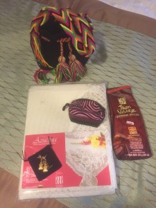 Treasures from Cartegena shopping - crocheted bag, small mola bag, reproduction earrings, large locally made lace tablecloth, Juan Valdez coffee